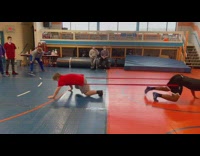 3 guys play tug of war with bands 