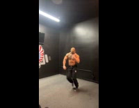Shirtless guy dances in dark room 
