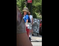 Man blue shirt wear multiple stacked hats