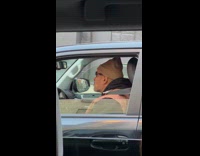 Guy sings and whistles while he drives 