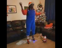 Woman in Super Mario costume and Santa hat dances to All I Want For Christmas is You song 