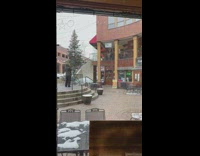 Man black and yellow jacket dance balcony store