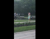 Two women dress tiktok dance video shoot park