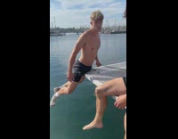 Guy hanging on an edge with his pelvic area