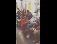 Girl sits with feet on lap guy