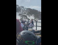 Woman white leggings raise legs seat snow