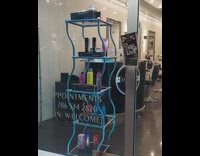 Moving rectangular shelf displaying products inside salon