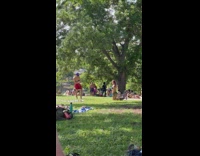 Woman blue bikini kneel on the grass park