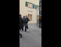 Man naked costume films side of street