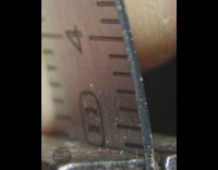 Guy bends metal ruler snaps in half