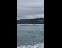 Woman naked lie down by the glacier lagoon