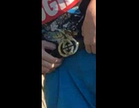 Blue pants guy dances by parked car 