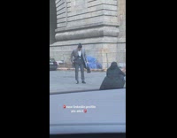 Man formal attire bun hair street pictorial