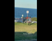 Man checkered polo hang sideways signage post