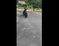 Guy black motorcycle donuts asphalt orange helmet 