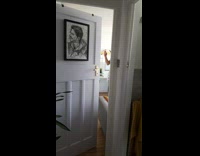 White apron guy spatula gold doorknob 