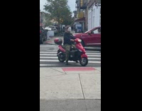 Masked man rides onto sidewalk with spooky music