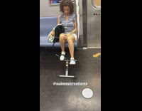 Woman uses pedal exercise machine on the subway train while sitting down