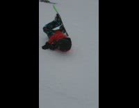 Red jacket kid falls over green snowboard 