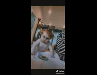 Shirtless baby with mom with funny filter on face