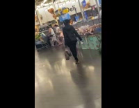 Woman walks with case of water on head