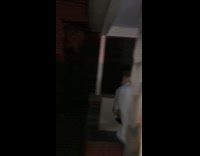 Teen in grey shirt throws television into street 