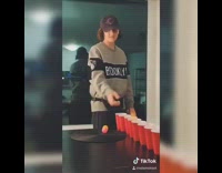 Guy throws balls line of red cups 