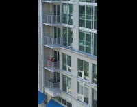 Girls red jersey shirt hug on balcony