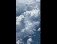 Collab DailyDoseOfInternet - Angry face formed in the clouds seen from airplane