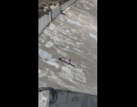 Shirtless Guy Sunbathes in a Dried Lake 