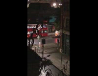 Pink pants girl throws bag red bus