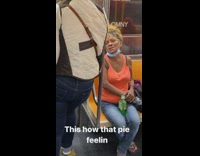 Guy holds pizza box upright under arm 