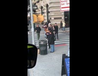 Girl wait guy dance street beside trash can