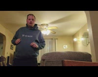 Guy dances in middle of living room 