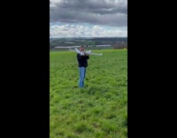 Man Holds Up Remote Controlled Plane for Take Off