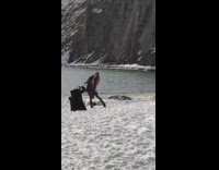 Girl black scarf hair flip snow beach