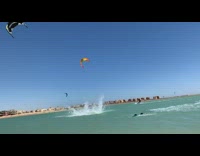 Guy strapped to parasail jumps in the air on wakeboard, loses board and crashes into ocean water