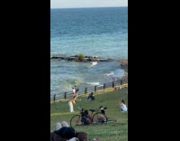 Collab IITW - Lady Bends Forward and Reaches towards Friend