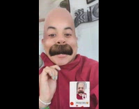 Lady wearing red jacket uses bald filter 