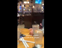 Waiter gives woman water and side of dr pepper