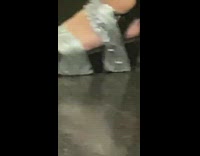 girl uses duct tape around black sandal