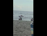 Black shorts guy girl yoga pose beach 