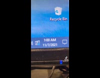 Camera zooms into computer clock changing to 1AM