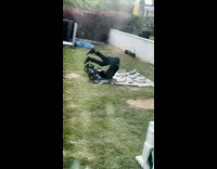 Man Exercising with Barbells Flops When Reverse Crunching 