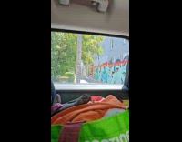 Woman black top dances graffitied alley wall