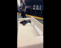 Collab WINY - Guys bring white large sofa in subway station