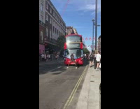 Man dances and blocks the bus on the road