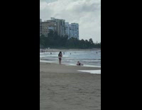 Woman red bikini la and kneel beach