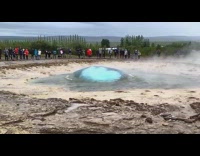 Water shoots up geyser slow motion people 