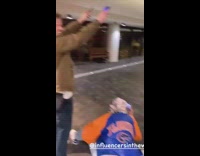 Woman stand over ground lights guy laugh